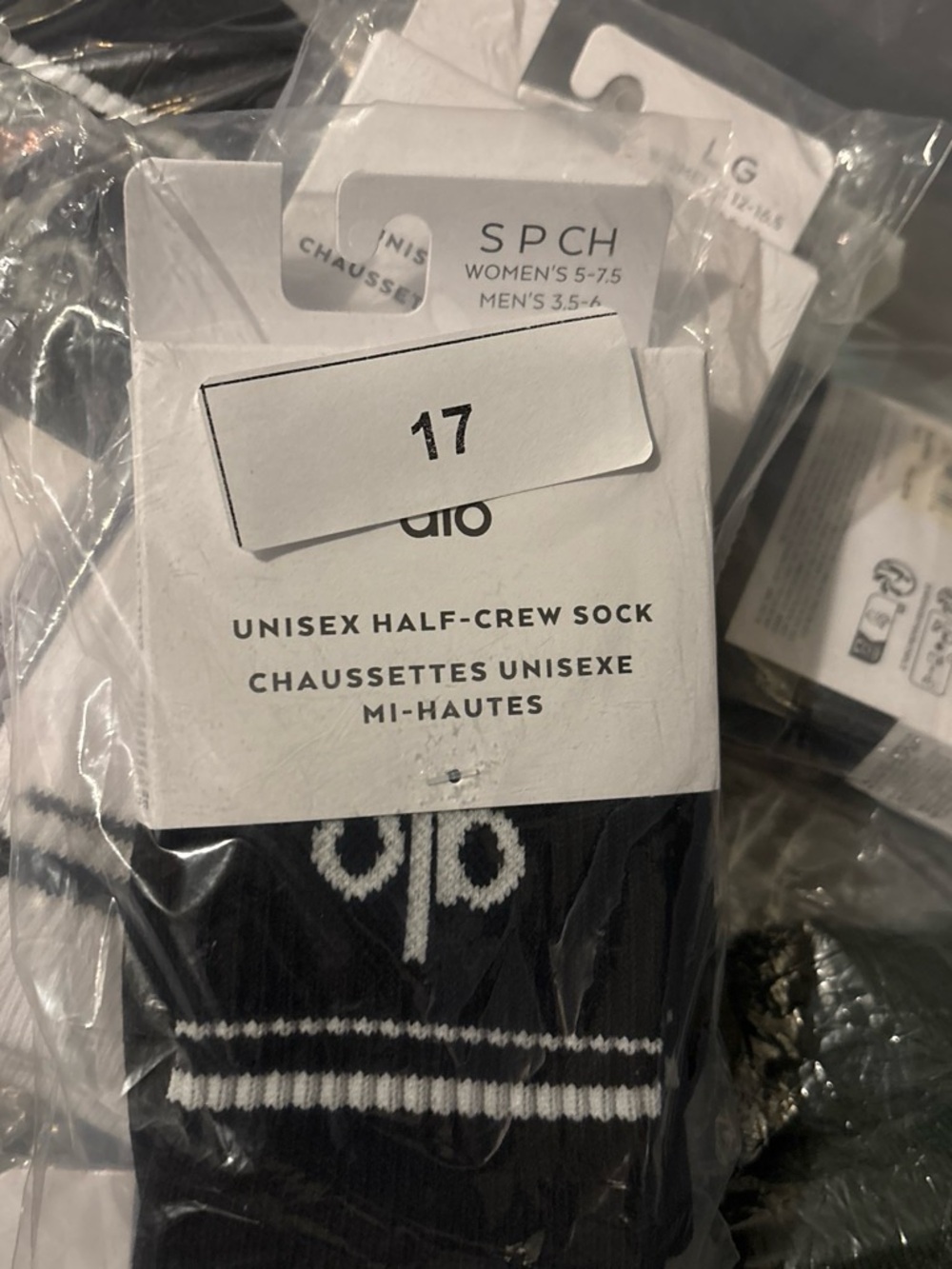 ALO Yoga Unisex Half-Crew Socks in Black with White Logo